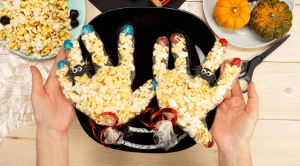 Halloween treats to hand out popcorn hands